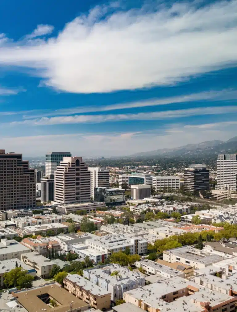 Glendale California downtown skyline with modern buildings and Verdugo Mountains in the background.