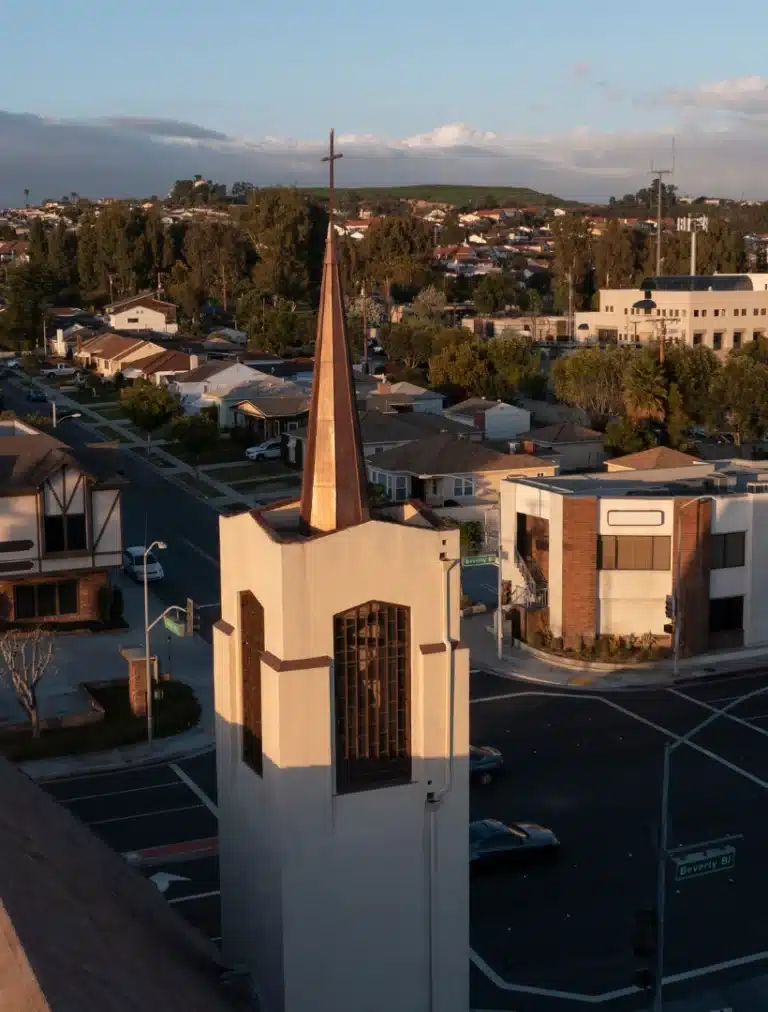 Aerial view of Montebello CA church with surrounding neighborhood streets and buildings